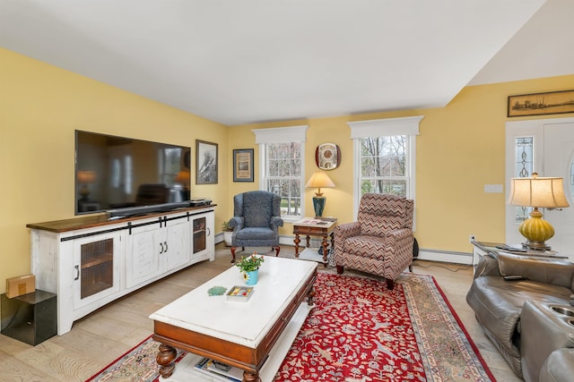 living room with a baseboard radiator and baseboard heating