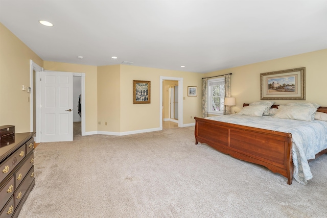 bedroom with baseboards, light carpet, recessed lighting, and a spacious closet