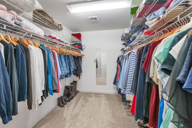 walk in closet featuring carpet floors and visible vents