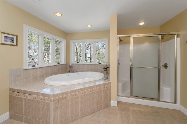 full bath with tile patterned floors, recessed lighting, baseboards, a garden tub, and a stall shower
