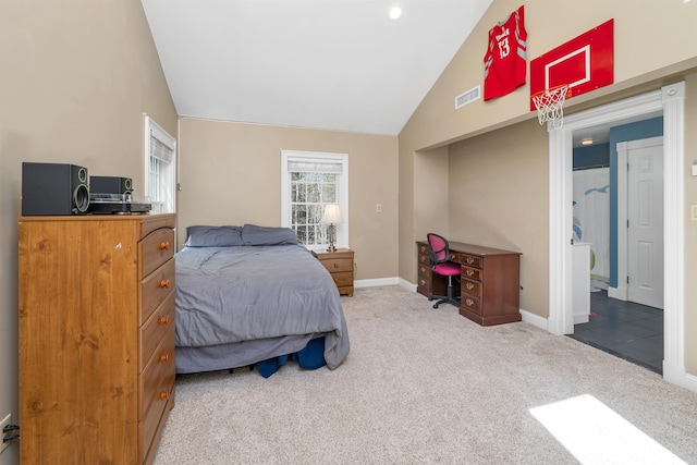 carpeted bedroom with baseboards, vaulted ceiling, and visible vents