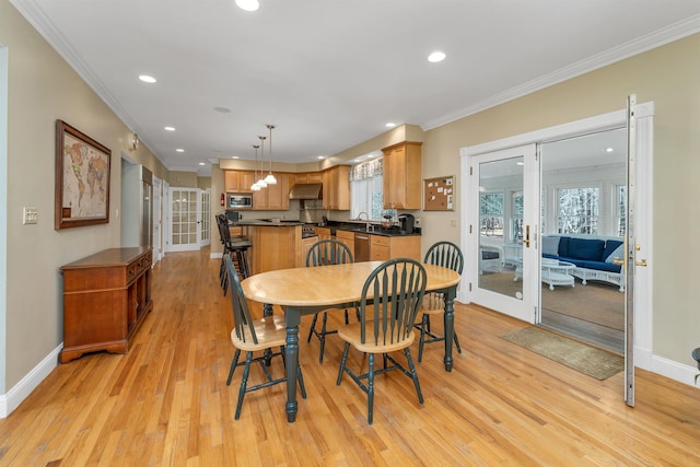 dining area with french doors, recessed lighting, baseboards, and crown molding