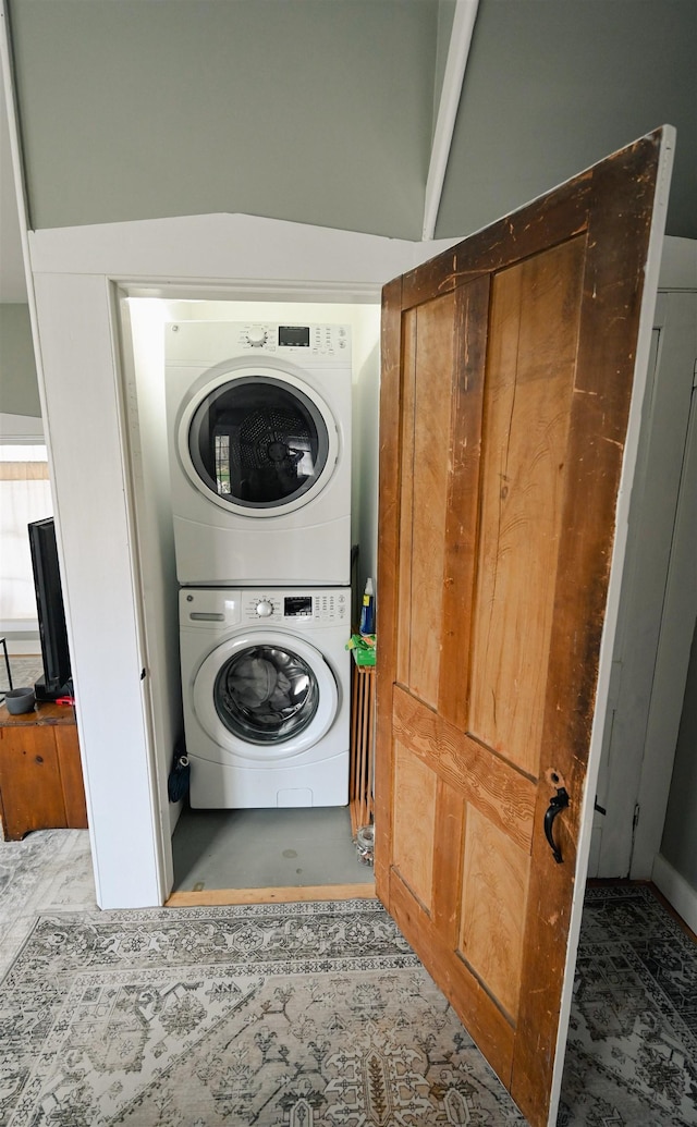laundry room with laundry area and stacked washing maching and dryer