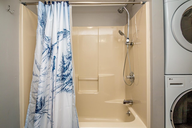 bathroom featuring stacked washing maching and dryer and shower / bath combination with curtain