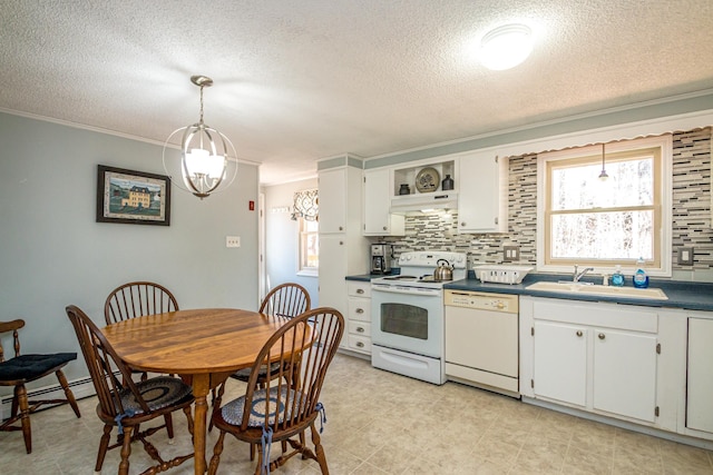kitchen featuring a sink, a textured ceiling, under cabinet range hood, and white appliances
