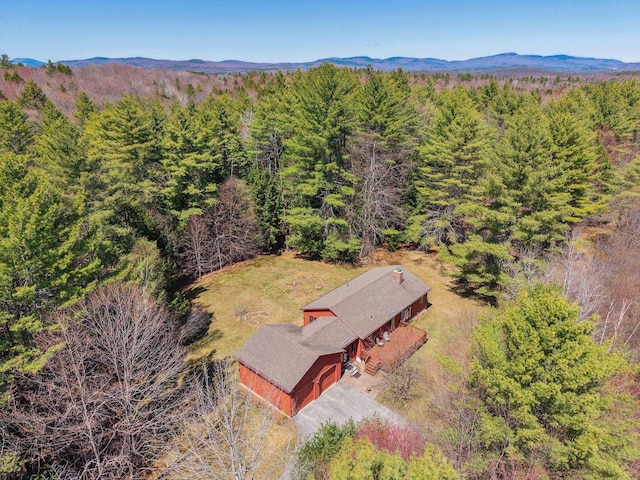 birds eye view of property featuring a view of trees