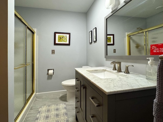 bathroom featuring vanity, marble finish floor, toilet, baseboards, and a stall shower