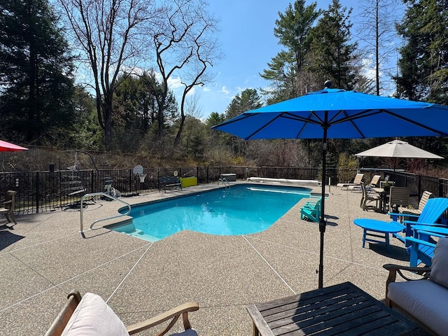 view of pool featuring a fenced in pool, fence, and a patio