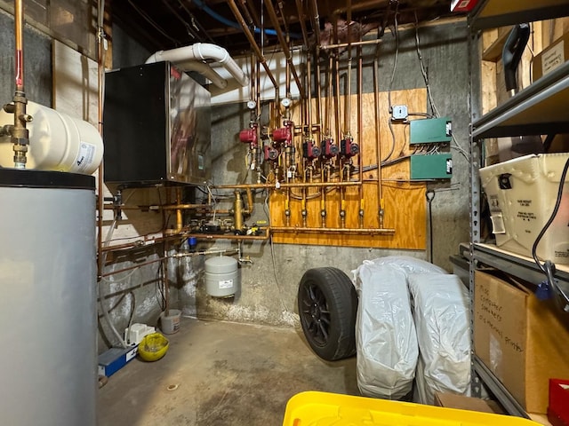 utility room featuring gas water heater