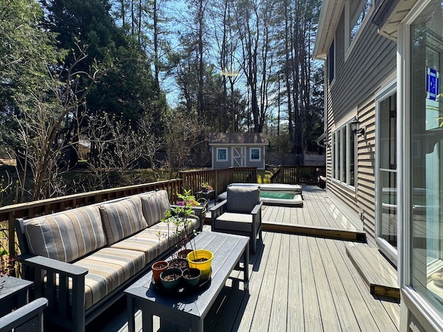 deck with an outdoor structure, an outdoor hangout area, and a shed