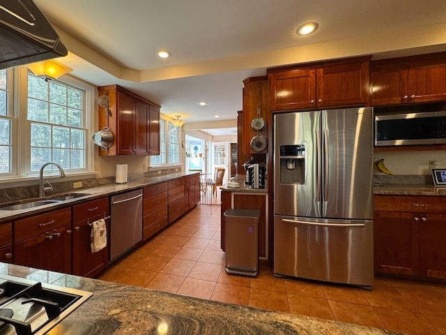 kitchen featuring a sink, light tile patterned floors, stainless steel appliances, recessed lighting, and extractor fan