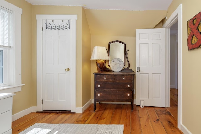 bedroom with baseboards and hardwood / wood-style floors