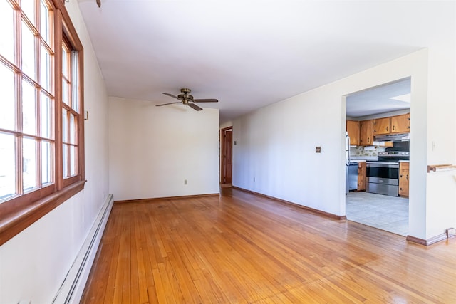 unfurnished living room featuring light wood-style floors, a baseboard radiator, baseboards, and ceiling fan