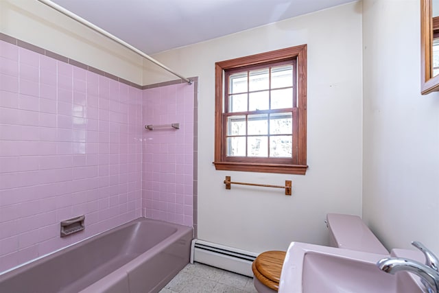 bathroom with a sink, shower / bathing tub combination, baseboard heating, and toilet