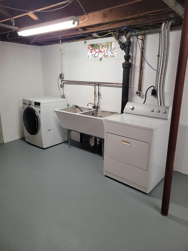laundry room with separate washer and dryer and laundry area