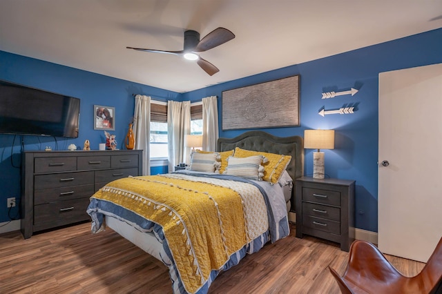 bedroom featuring a ceiling fan and wood finished floors