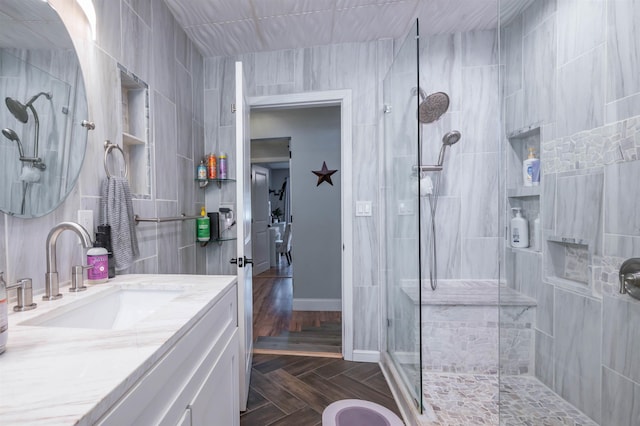 full bathroom with vanity and walk in shower
