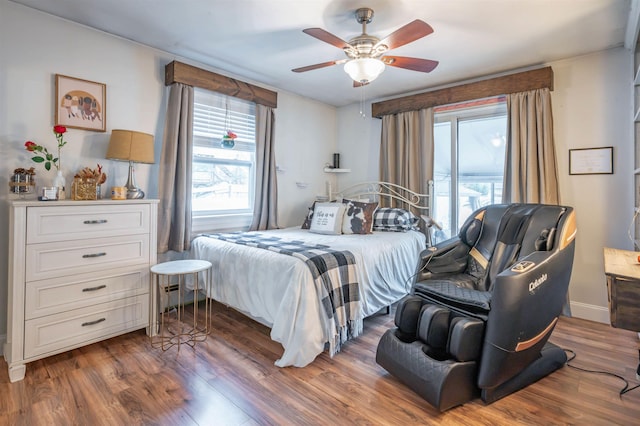 bedroom featuring a ceiling fan and wood finished floors