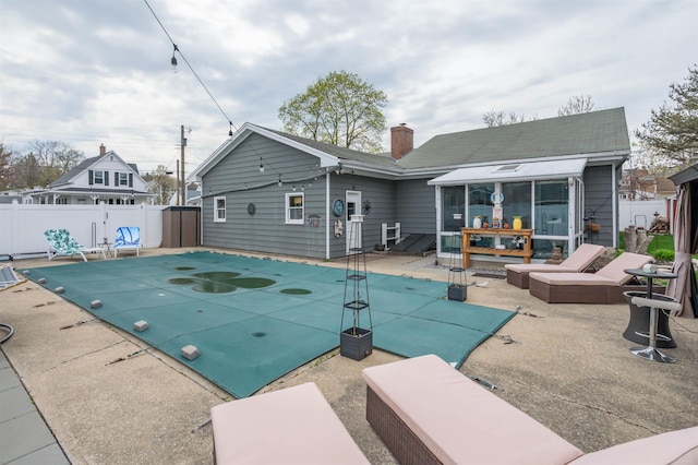 view of pool with fence, a fenced in pool, and a patio area