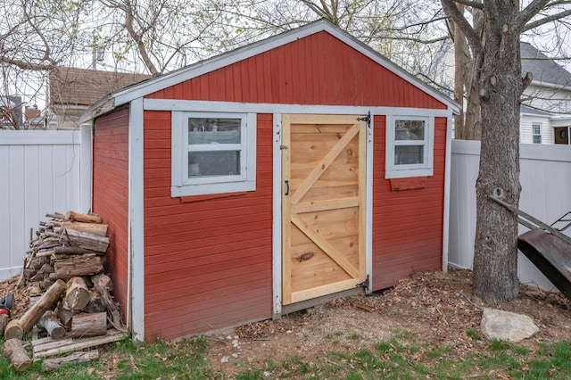 view of shed with a fenced backyard