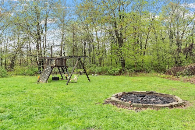 134 Emerson Ave, Hampstead, NH 03841 - view of green lawn with a playground and an outdoor fire pit