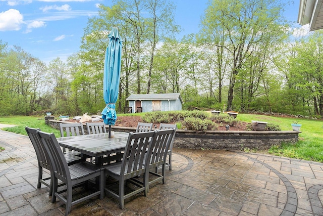 134 Emerson Ave, Hampstead, NH 03841 - view of patio featuring outdoor dining area and an outdoor structure