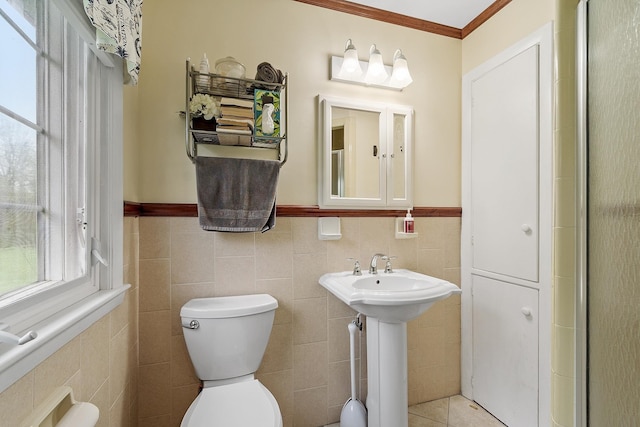134 Emerson Ave, Hampstead, NH 03841 - bathroom featuring tile walls, toilet, a wainscoted wall, and crown molding
