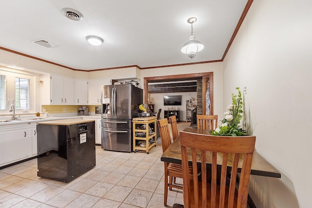 134 Emerson Ave, Hampstead, NH 03841 - kitchen featuring stainless steel fridge, a sink, light countertops, crown molding, and white cabinetry