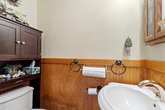 134 Emerson Ave, Hampstead, NH 03841 - bathroom featuring a sink, a wainscoted wall, and toilet