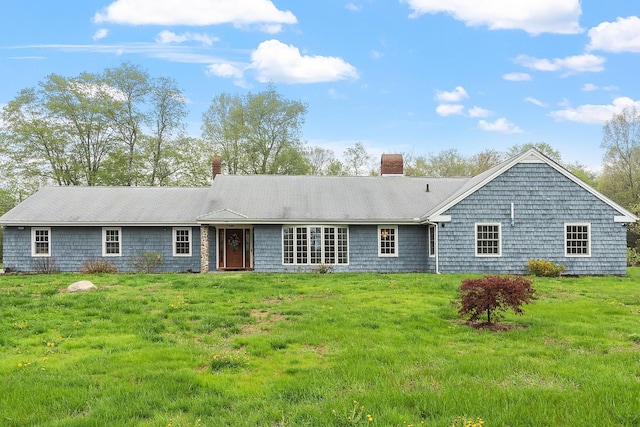 134 Emerson Ave, Hampstead, NH 03841 - rear view of house with a chimney and a lawn