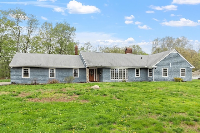 134 Emerson Ave, Hampstead, NH 03841 - rear view of house with a chimney and a lawn