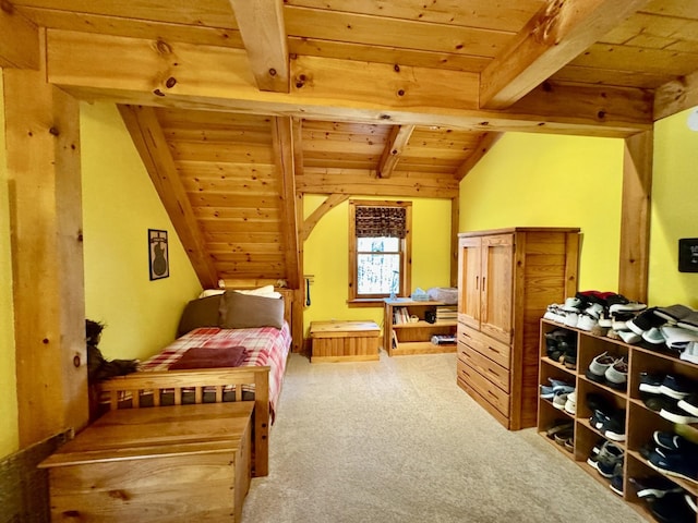 bedroom featuring light colored carpet, lofted ceiling with beams, and wood ceiling
