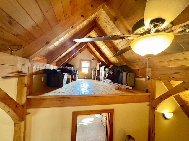 additional living space featuring wooden ceiling and vaulted ceiling with beams