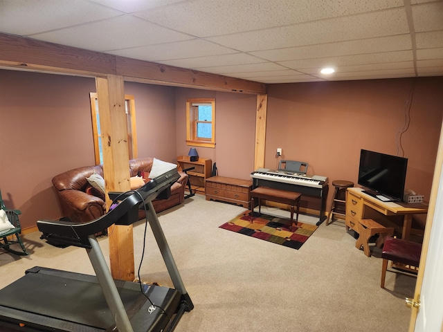 exercise area featuring carpet and a drop ceiling