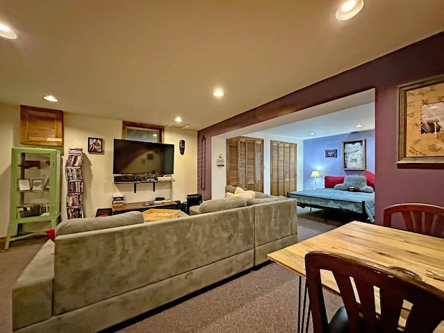 carpeted living area featuring recessed lighting
