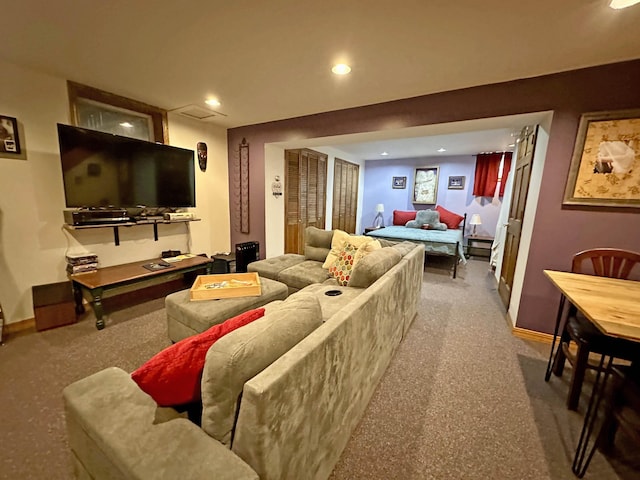 carpeted living room featuring baseboards and recessed lighting