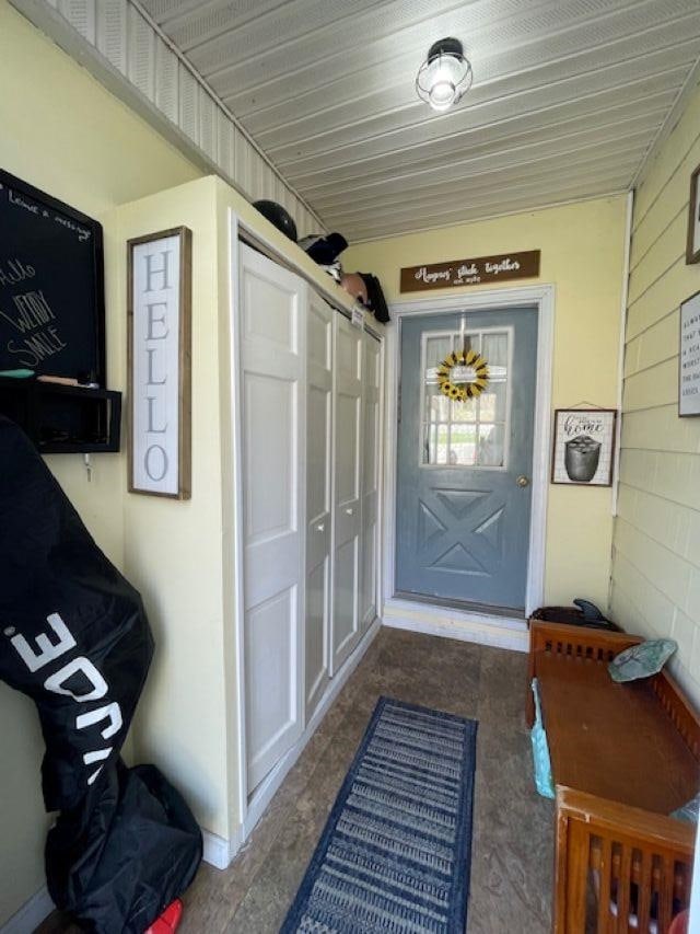 view of exterior entry with covered porch