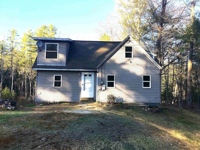 back of house featuring a yard