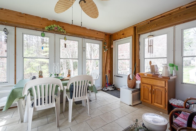 sunroom / solarium featuring french doors and tile patterned flooring