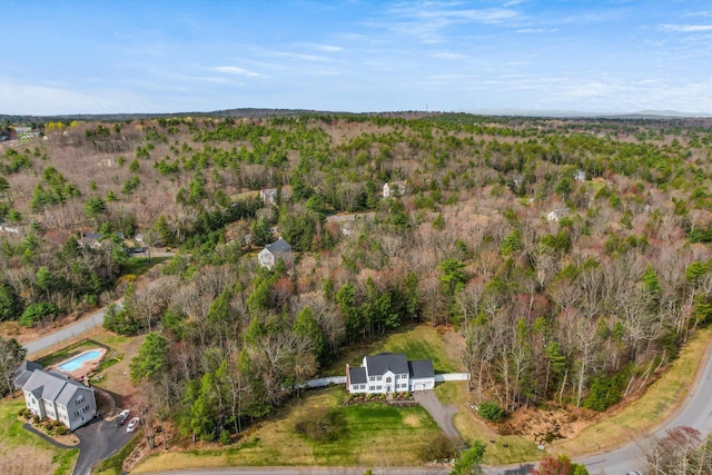 drone / aerial view with a view of trees