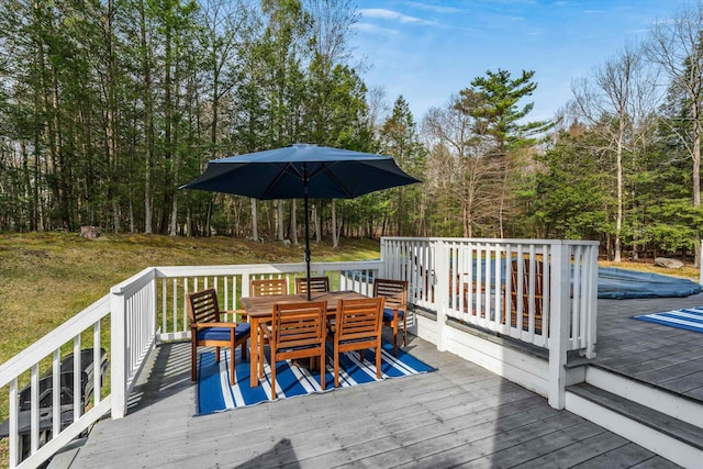 wooden deck with outdoor dining area