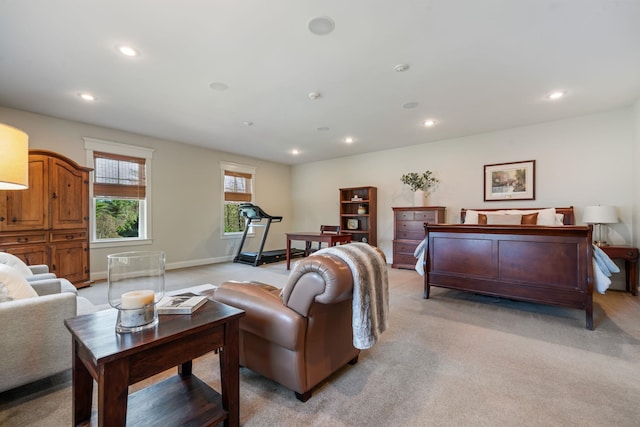 living room with recessed lighting, baseboards, and light colored carpet