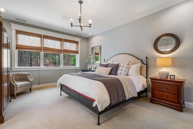 bedroom with baseboards, visible vents, a notable chandelier, and light colored carpet