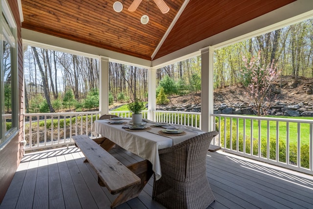 wooden deck featuring a ceiling fan