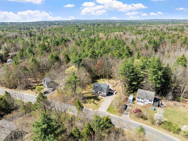 drone / aerial view featuring a forest view