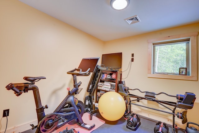 workout area featuring baseboards and visible vents