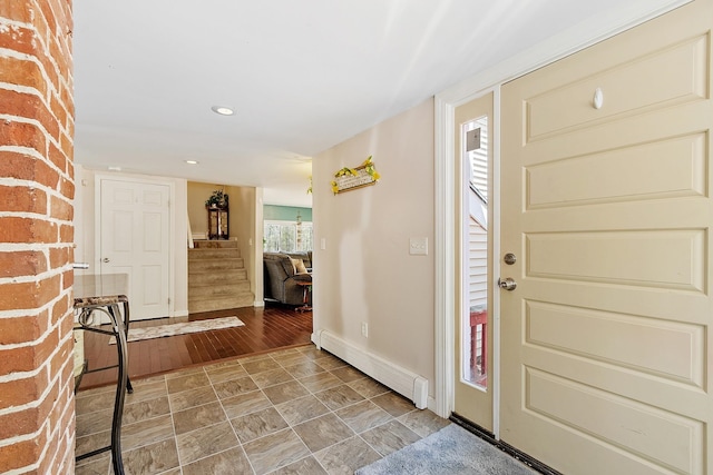 entrance foyer with baseboards, recessed lighting, a baseboard radiator, and stairway