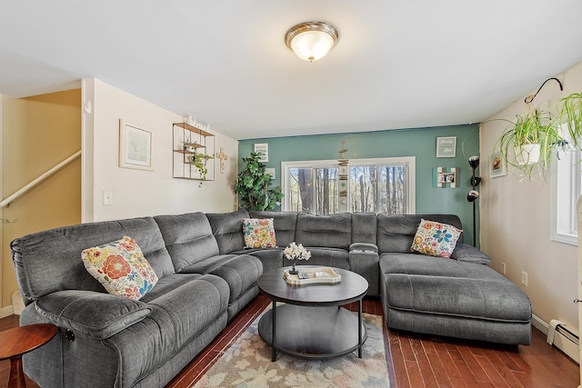 living room featuring baseboards, a baseboard radiator, and wood finished floors