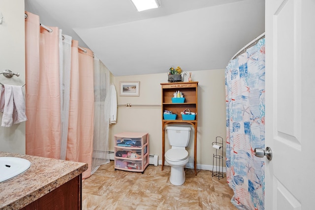 full bath with vanity, toilet, baseboards, lofted ceiling, and a baseboard heating unit