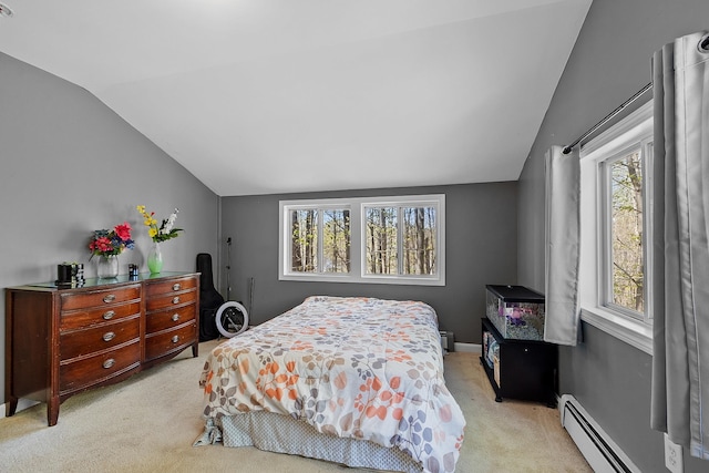 bedroom featuring a baseboard radiator, lofted ceiling, carpet flooring, and baseboard heating